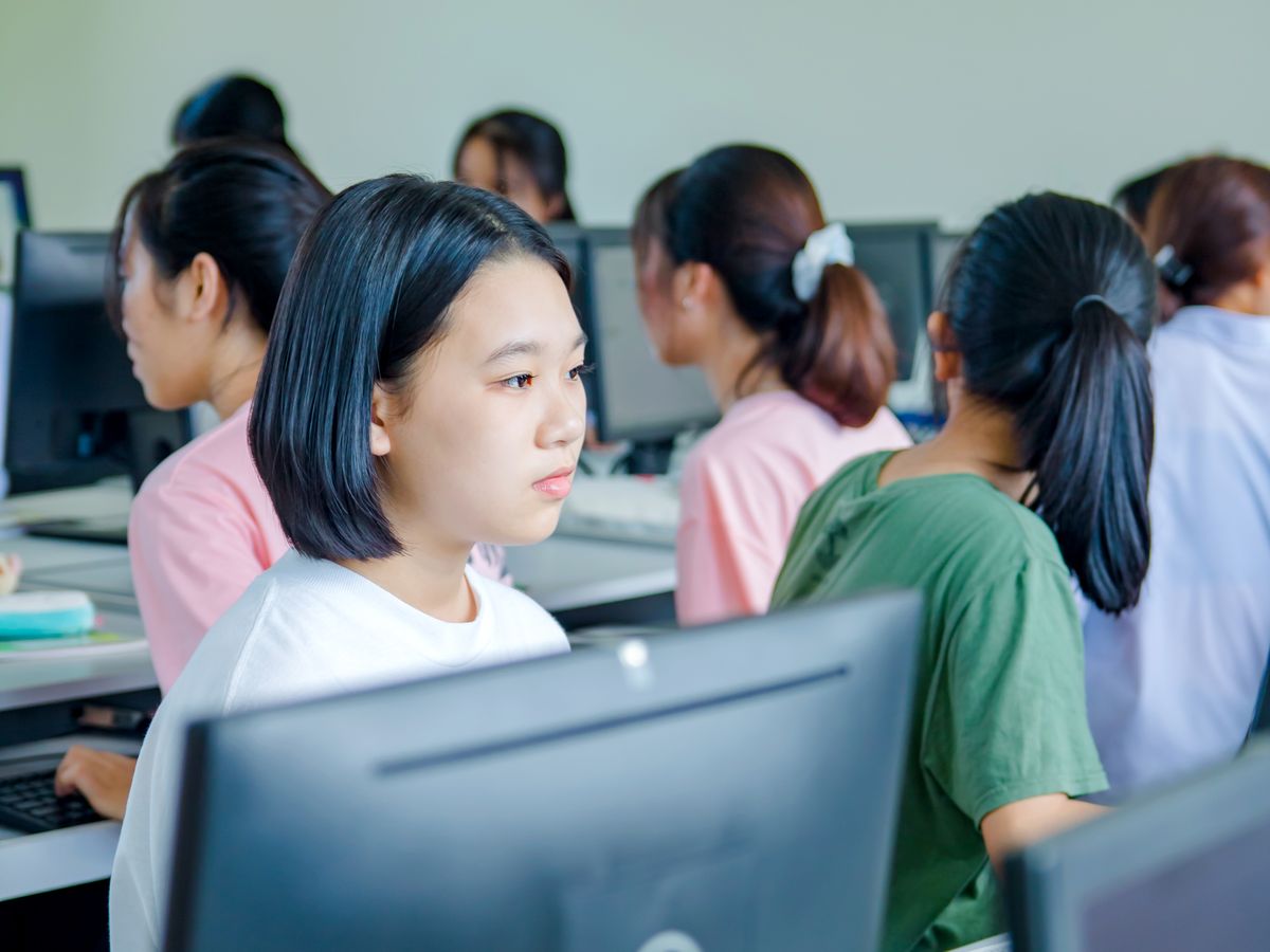 Students focused on learning in a modern school computer lab
