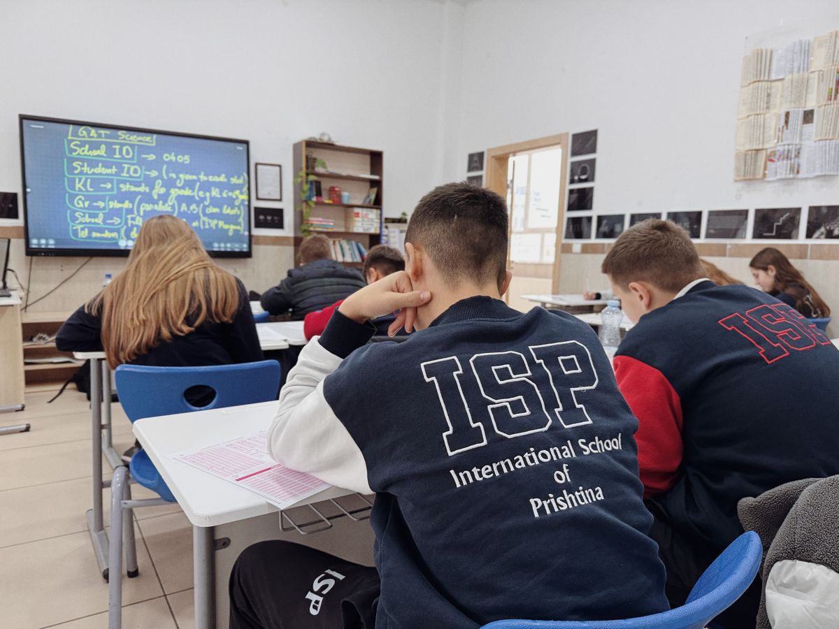 Secondary students attending class in a modern international school classroom