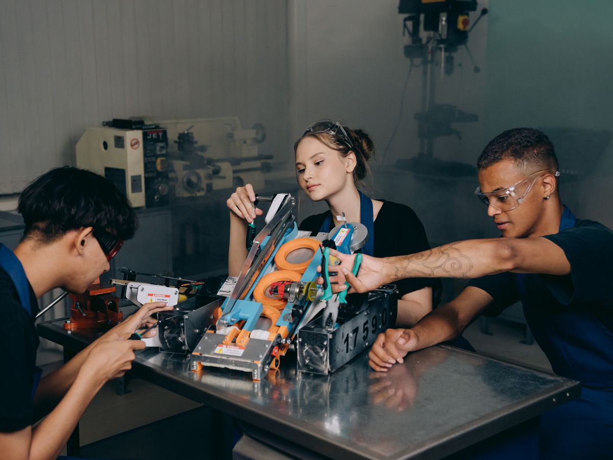 Students assembling a robotics project together in a STEM laboratory